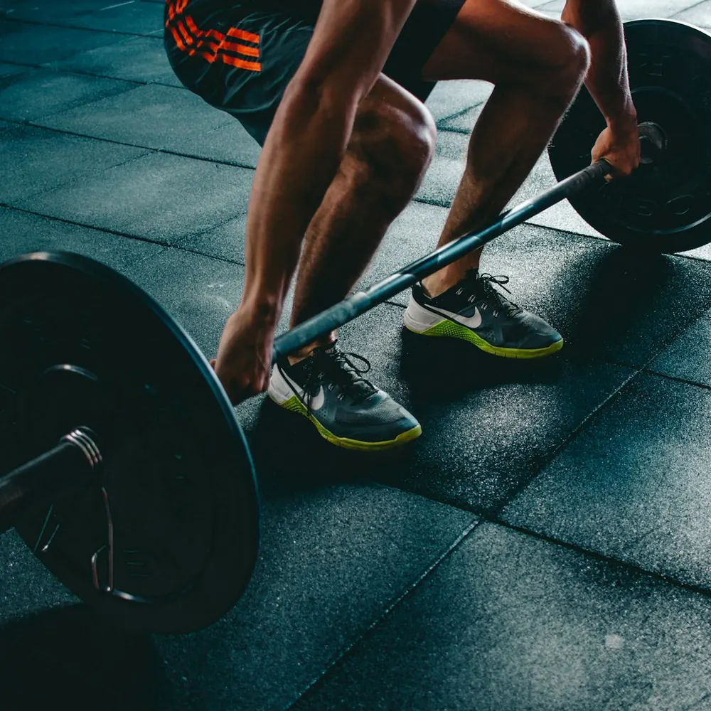 Athlete setting up a heavy deadlift